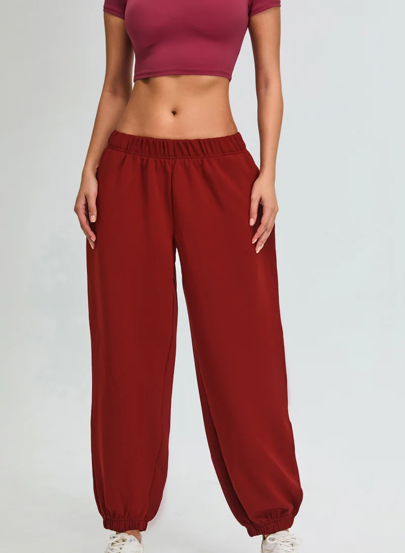Kawn.yoga Crimson Red Mid Waist Oversized Joggers for Women | Best Price UAE
